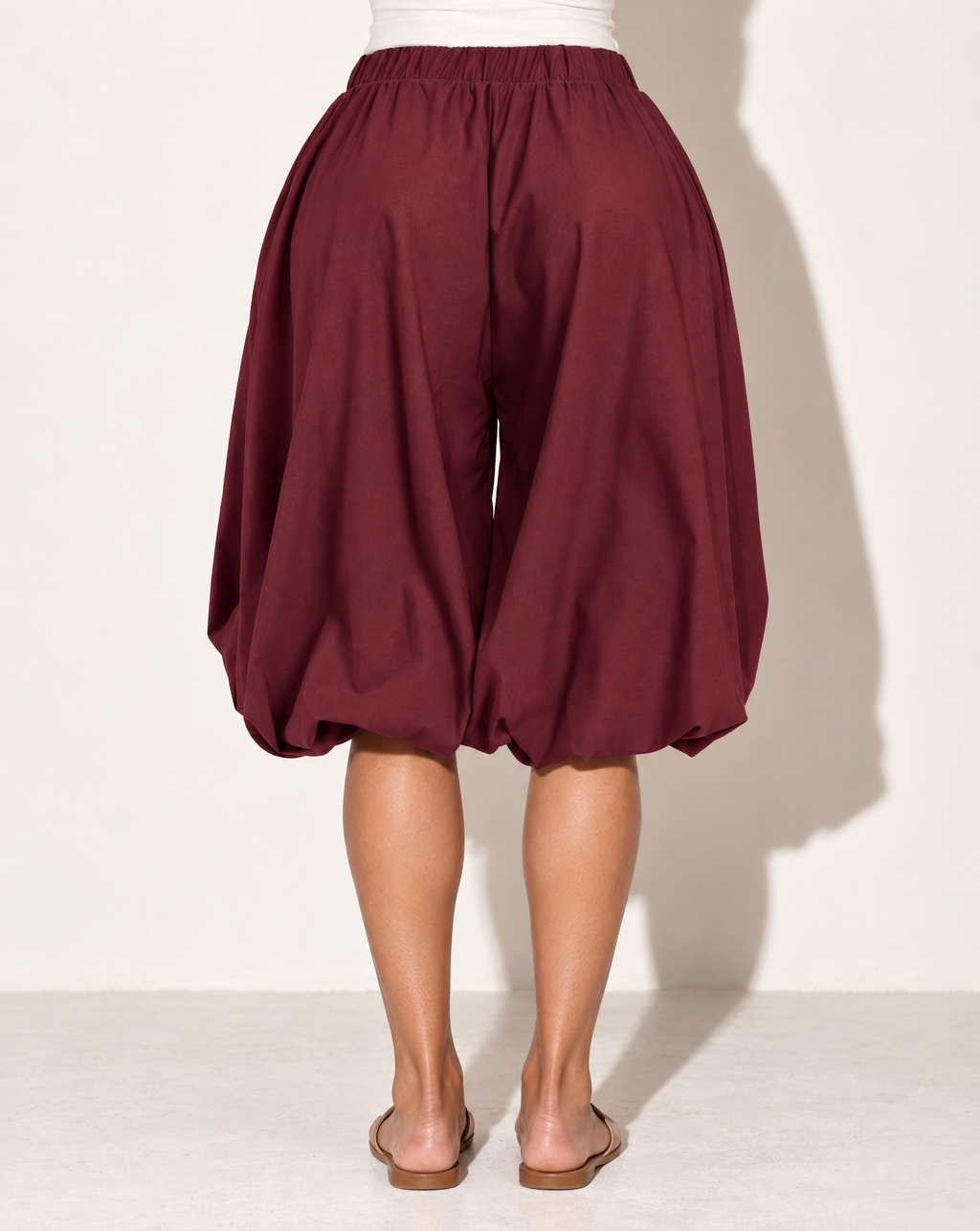 Wide Bubble Hem Capri Pants in Burgundy — back view