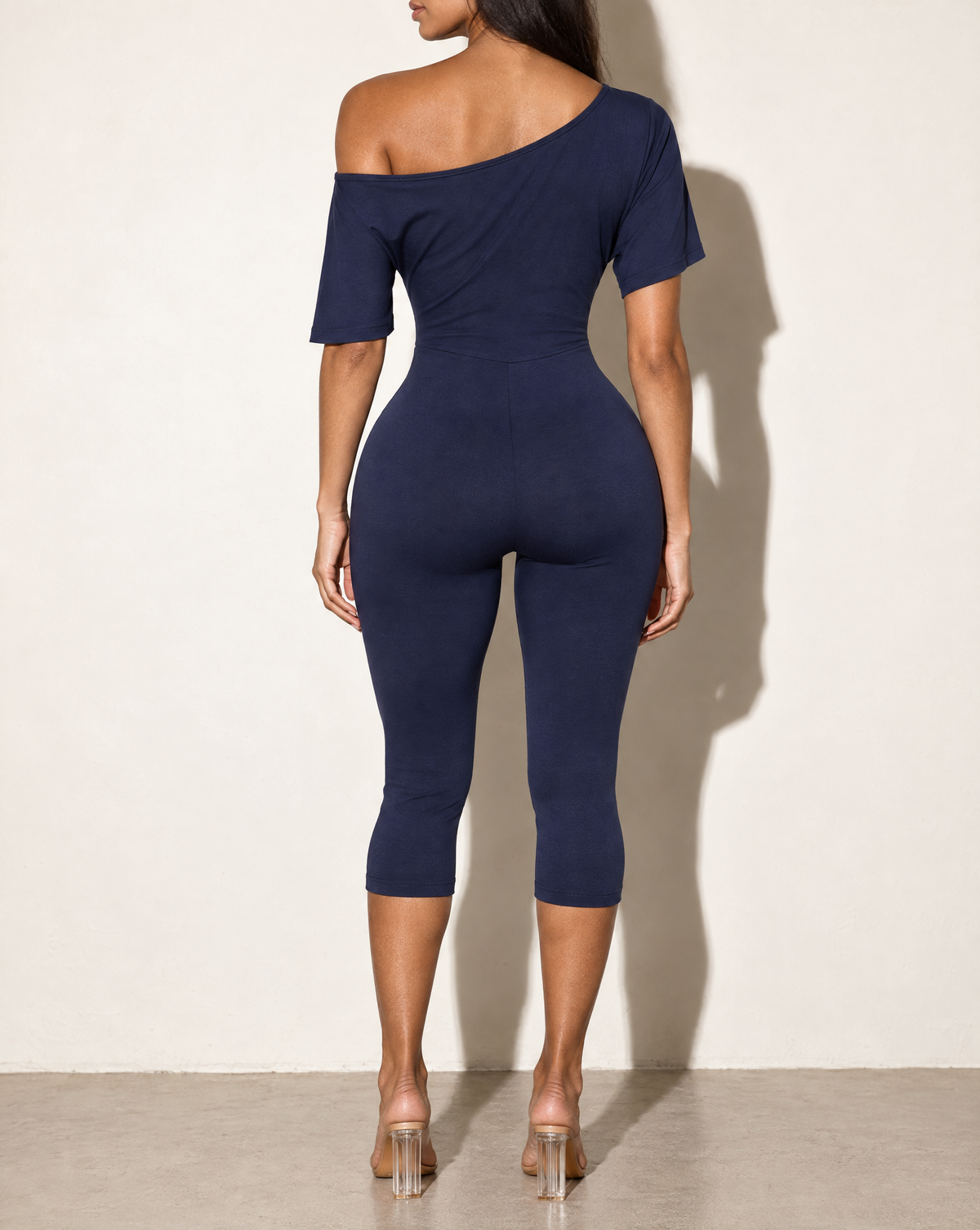 One Off Shoulder Capri Jumpsuit in Navy — back view