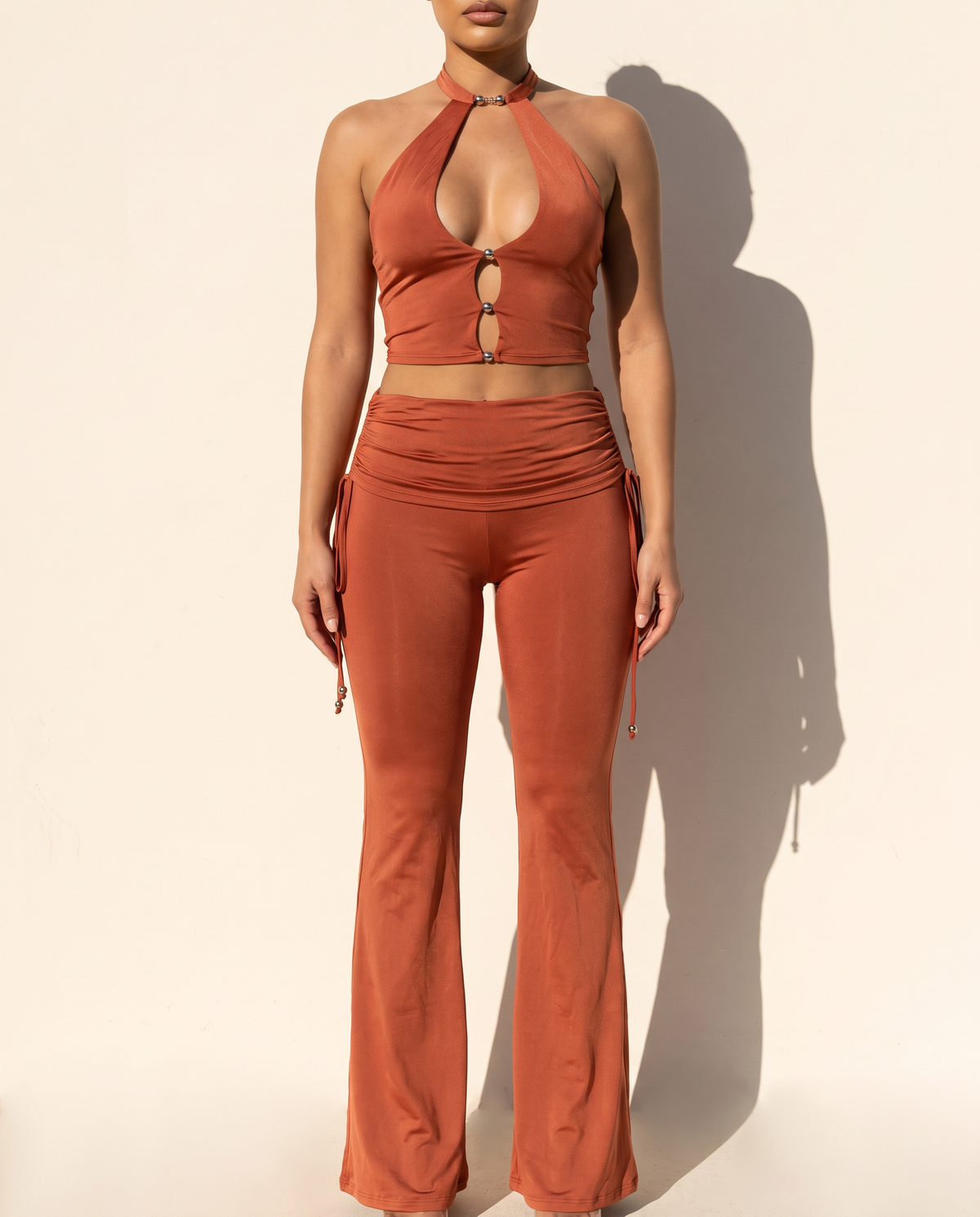 Trim Detailed Halter Top & Flare Pants Set in Rust — front view