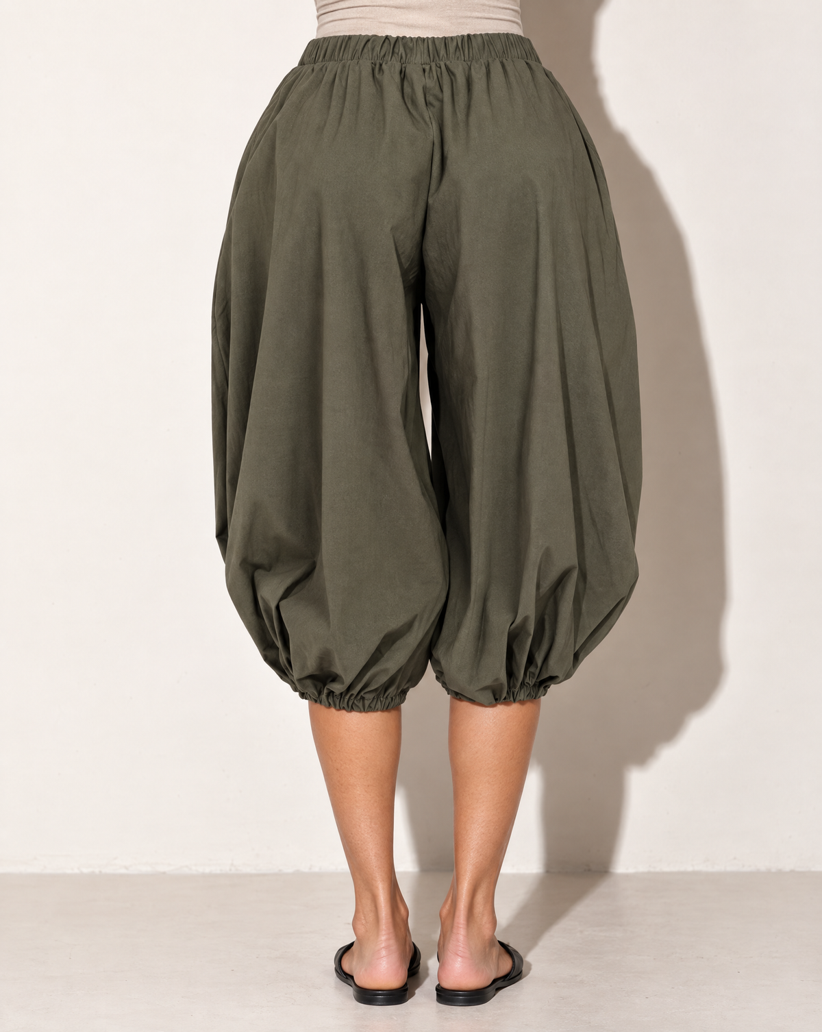 Wide Bubble Hem Capri Pants in Olive — back view