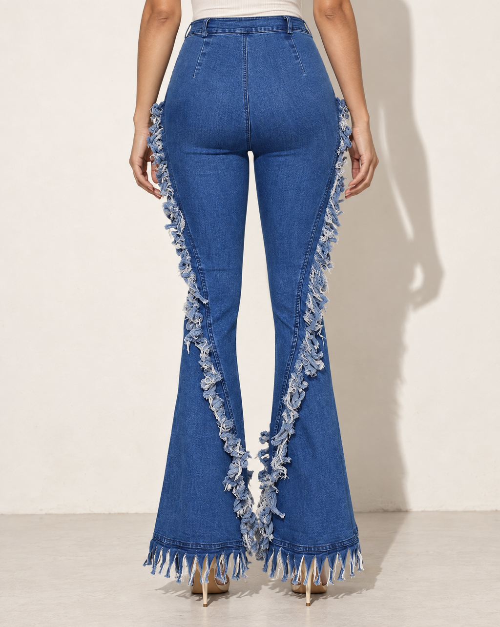 Distressed Fringe Denim Flared Pant in LT BLUE — back view