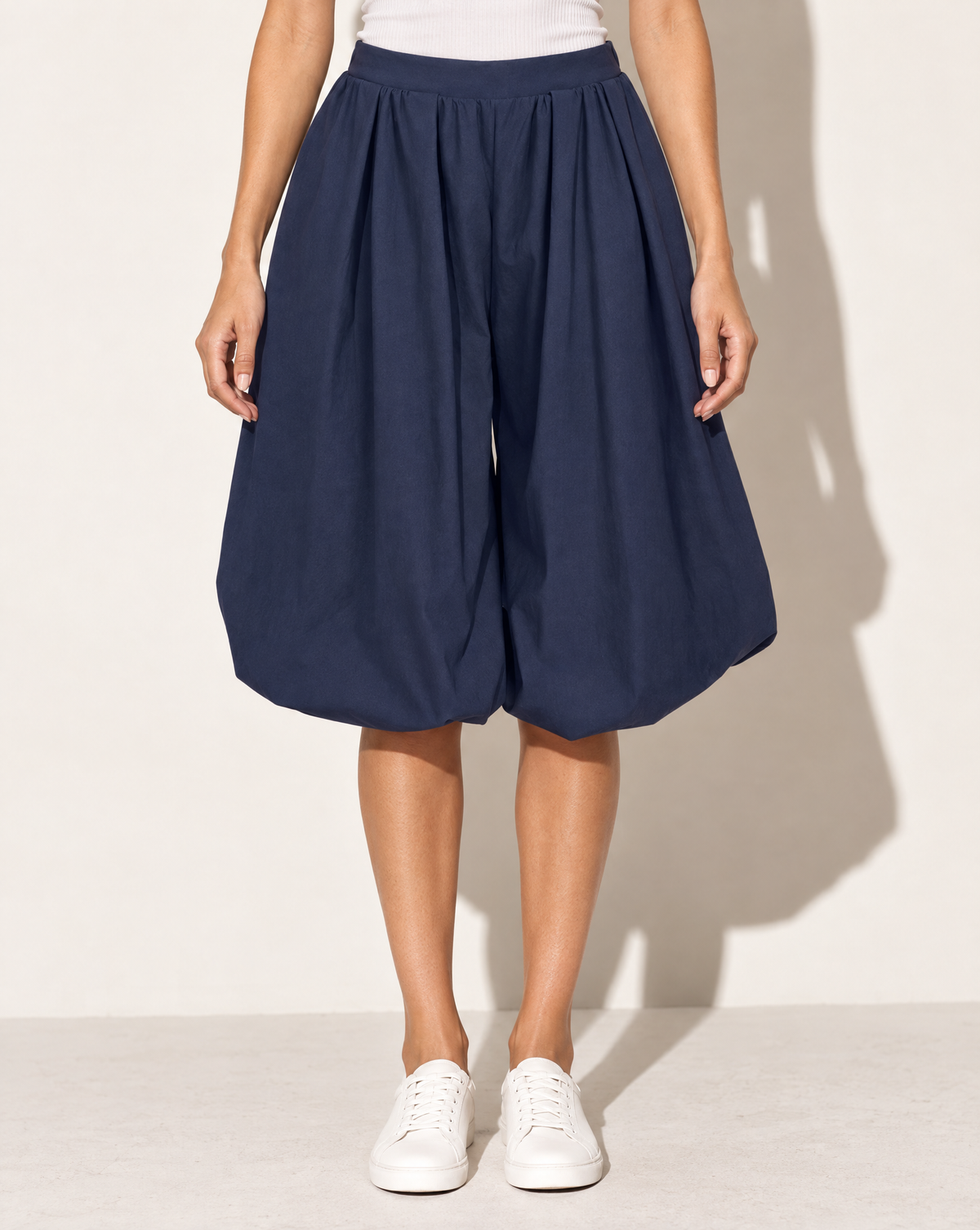 Wide Bubble Hem Capri Pants in Navy — front view