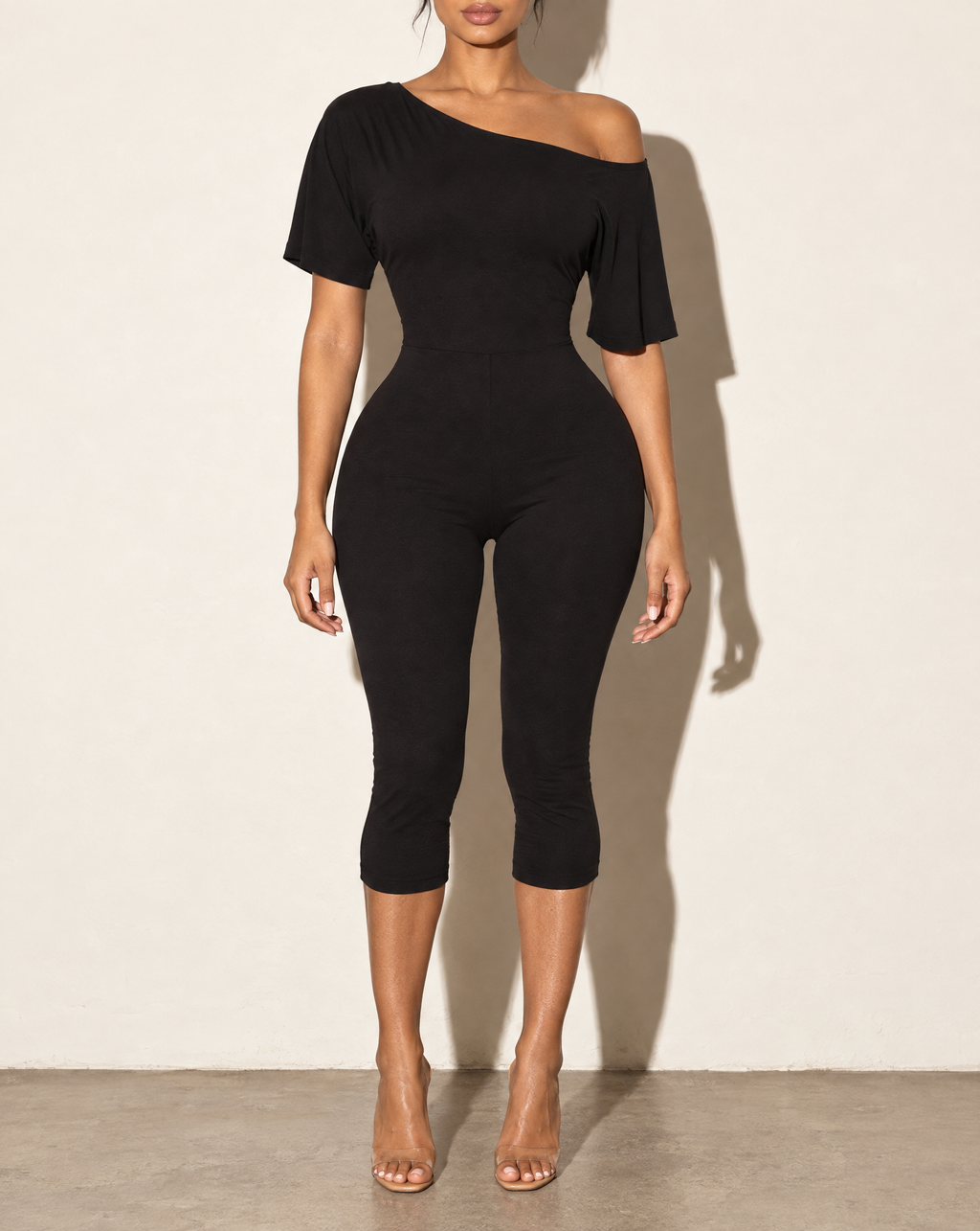 One Off Shoulder Capri Jumpsuit in Black — front view