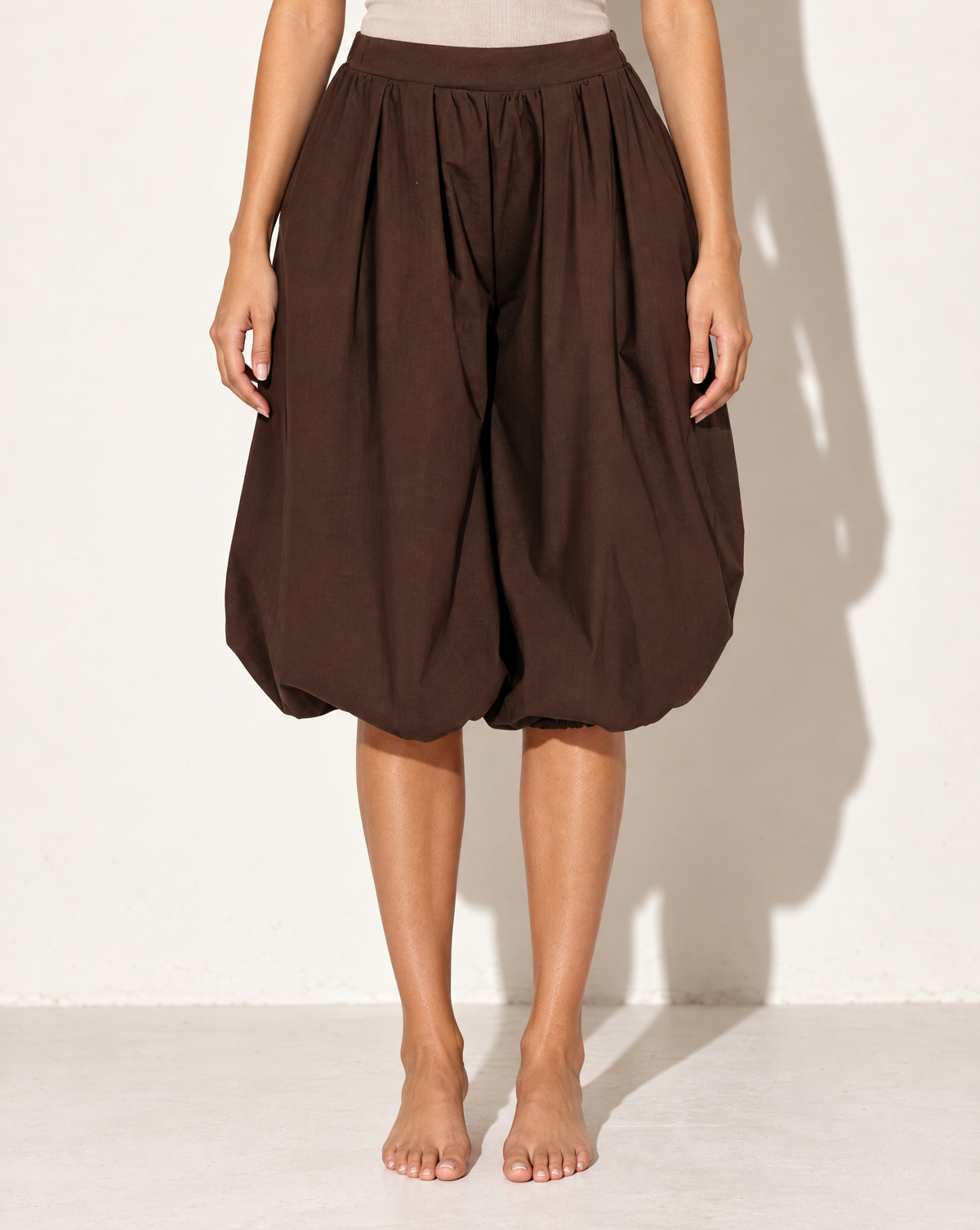 Wide Bubble Hem Capri Pants in Brown — front view