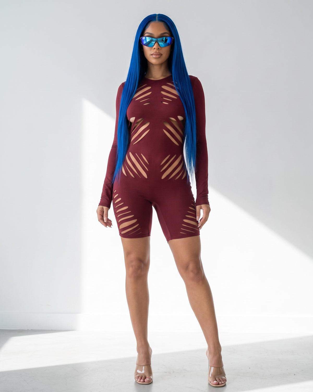 Die Cut Detailed Long Sleeve Open Back Romper in Burgundy - front view on model | Muvin