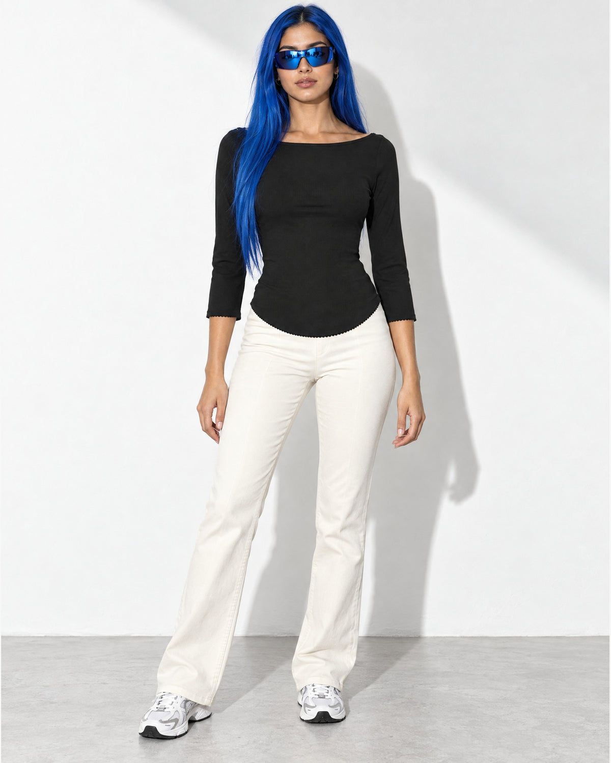 3/4 Sleeves Round Hem Top in Black - front view on model | Muvin