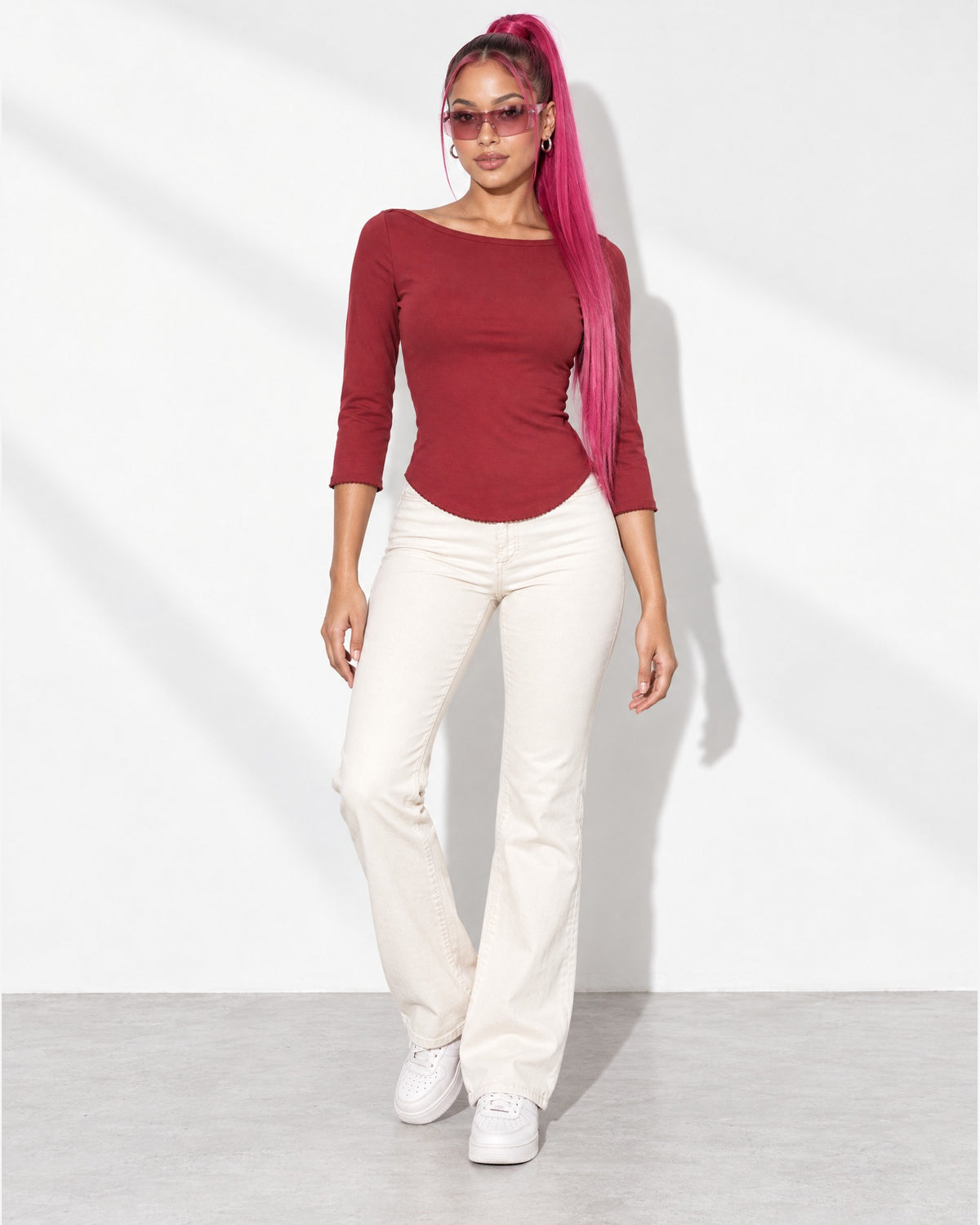 3/4 Sleeves Round Hem Top in Burgundy - front view on model | Muvin
