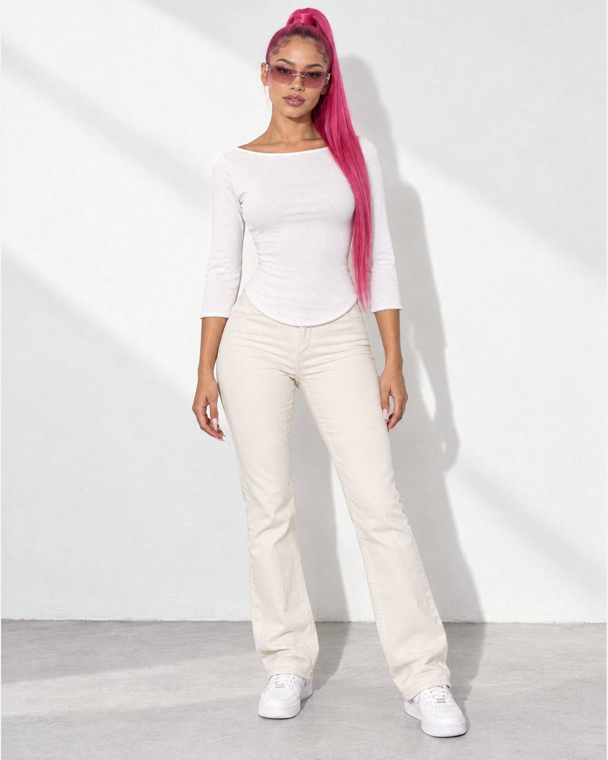 3/4 Sleeves Round Hem Top in White - front view on model | Muvin