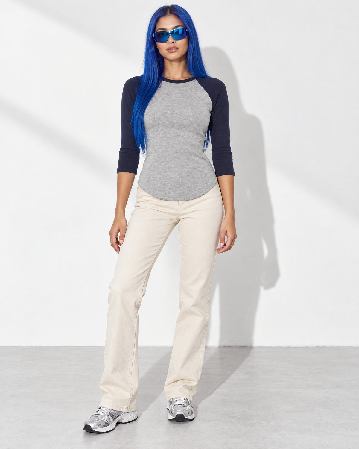 3/4 Raglan Sleeves Round Hem Top in Navy/Grey - front view on model | Muvin