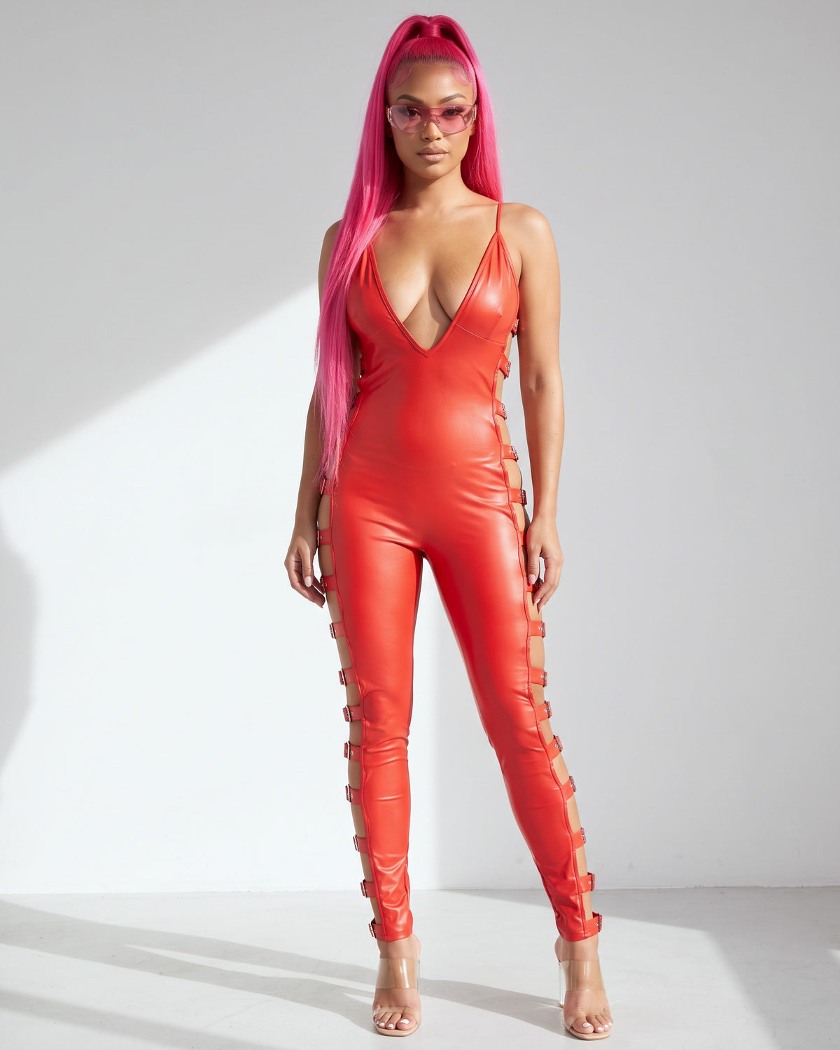Buckle Trimmed Matte PU Jumpsuit in Red - front view on model | Muvin
